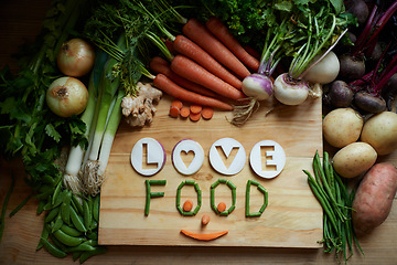 Image showing Vegetables, empty and cutting board for healthy food background, cooking and preperation of soup ingredients on table. Culinary, organic and green groceries for vegan love, health and wellness above