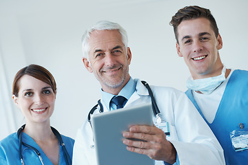 Image showing Tablet, meeting and portrait of doctor with nurses in hospital for medical diagnosis or treatment discussion. Team, digital technology and surgeon talking to healthcare workers for surgery in clinic.