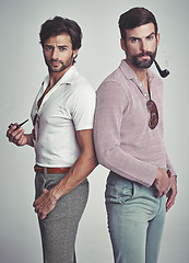 Image showing Fashion, men and portrait or pipe in studio with vintage model, hipster outfit and confidence or serious expression. Friends, people and attitude with 70s style or retro clothes with white background