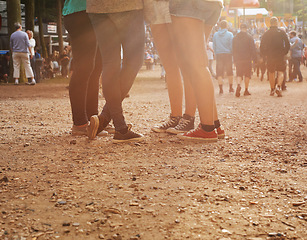 Image showing Legs, forest and group of people at festival together for social event, party or summer celebration. Flare, crowd and friends in woods for talking, bonding or free time in nature with audience