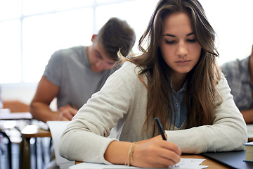 Image showing University, writing and woman in classroom with notebook for development in learning, opportunity and future. Education, knowledge and growth for college student in lecture, studying for exam or test