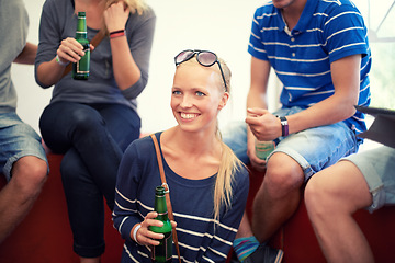 Image showing Smile, beer and woman with group of friends for party, celebration or happy adventure together. Smile, drinks and girl on vacation event, relax and bonding with alcohol at holiday festival in Munich.