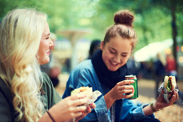 Image showing Snack, women and music festival with friends, conversation and happiness with joy and bonding together. People, outdoor and girls with fast food and takeaway with summer break or concert with culture