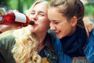 Image showing Portrait, concert and women with a bottle of wine, hug and smile with happiness or bonding together. Funny, people or outdoor with friends or alcohol with weekend break or excited with music festival