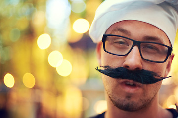 Image showing Man, portrait or mustache and beret at festival for comic face, creative or confident in french fashion in nature. Person, glasses and happy in outdoor at carnival, bokeh and summer holiday in europe