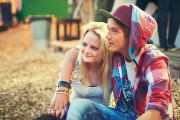 Image showing Couple, teenager and music at concert, festival and performance while bonding in Australia. Trendy, teen and youth on date as sitting outside with smile, happiness and love at punk, show and live gig