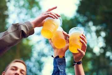 Image showing Friends, beer and toasting in nature for celebration, bonding and unity in Canada from low angle. Group of people, hands and cups with alcohol for fun, entertainment and enjoyment outdoors in forest