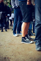 Image showing People, feet and music festival in nature to party, social and youth in trendy fashion at event. Group, legs or community in denim jeans at carnival, culture or crowd by reunion celebration in forest
