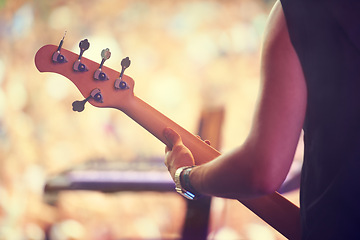 Image showing Man, festival and guitar at stage for concert, performance and back view in Amsterdam. Closeup of male musician, standing and playing instrument at live event for crowd, audience and enjoyment