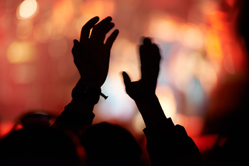 Image showing Silhouette, hands and clap at music festival for concert entertainment for celebration, news years or carnival. Person, fingers and stage lights for live performance or crowd holiday, night or event