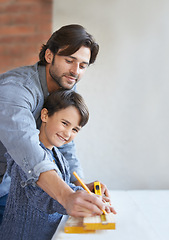 Image showing Father, son and woodwork or teaching carpenter or measuring tape for helping, bonding or home repairs. Male person, child and face or parenting mentor for learning or furniture, lesson or building