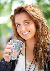 Image showing Portrait, smile and woman with drink at music festival, bokeh or celebration outdoor. Face, happy or girl with beverage at party, alcohol and beauty of young female person on summer holiday in France