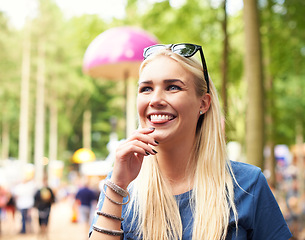 Image showing Outdoor, smile and music festival with woman, thinking and happiness with peace and excited on a holiday. Person, concert and forest with sunshine and weekend break with joy, event and party for fun