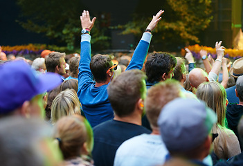 Image showing Crowd, people and music festival with fans, cheering and happiness with celebration and event. Party, audience and outdoor with joy and shouting with New Years and excited for performance and sound