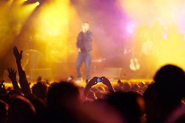 Image showing Music festival, audience and hands in crowd with band for concert, night club and cheering with light. Disco, party and people with signs, gesture and performance at rock event with entertainment