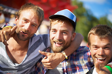 Image showing Men, happy or portrait of friends at music festival, event or embrace at social gathering with thumbs up. Face, smile or group of people at party, carnival or concert for celebration together outdoor