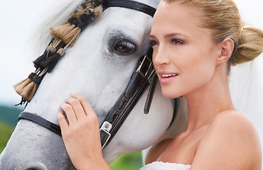 Image showing Bride, countryside and horse with face, portrait and smile for nature, connection and celebration. Woman, animal and uk field for wedding, love and happiness with summer, meadow and horse riding