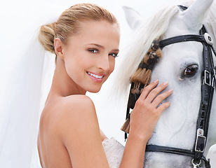 Image showing Bride, smile and horse with face, portrait and countryside for nature, connection and celebration. Woman, animal and uk field for wedding, love and happiness with summer, meadow and horse riding