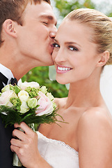 Image showing Couple, smile and portrait for wedding at ceremony for love, unity and love with kiss. Husband, wife and love at marriage celebration for commitment, partnership and union for with flower bouquet