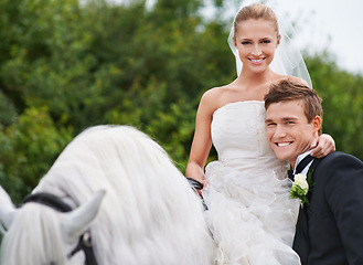 Image showing Couple, marriage and horse with nature, countryside and celebration for love, portrait and smile. Groom, wife and uk forest with happiness, wedding and horse riding for honeymoon, vacation or holiday