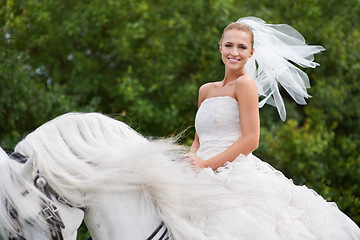 Image showing Wedding, woman and portrait or riding with horse outdoor for celebration, marriage and confidence in countryside. Bride, person and stallion on lawn in field with smile, dress and animal at ceremony