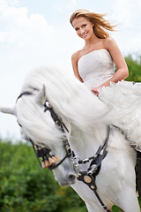 Image showing Wedding, woman and portrait with horse outdoor in nature for celebration, marriage or confidence in countryside. Bride, person and stallion in field with smile, dress and animal at ceremony in nature