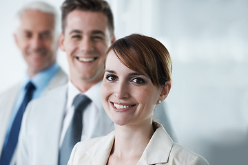 Image showing Portrait of three corporate business people , standing in a row and in an office . Three diverse colleagues , standing in boardroom , employees , team leader and two men aged private company