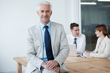 Image showing Smile, manager and portrait of businessman in office at meeting with team for corporate legal case. Happy, confident and senior male attorney ceo on table in workplace boardroom for law project.