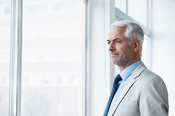 Image showing Mature, man and thinking of business at window, planning for future and idea for office. Professional, mindset and businessman remember a dream for company and consider decision, choice or solution