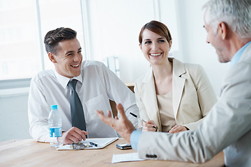 Image showing Laughing,, smile or business people in meeting for teamwork or planning growth strategy ideas. Happy, humor and CEO speaking of funny joke with group of employees, colleagues or workers in boardroom