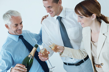 Image showing Champagne, boss or happy business people in office party in celebration of target or success together. Drinking, pour or toast with team, CEO or group of colleagues in workplace for winning or goals