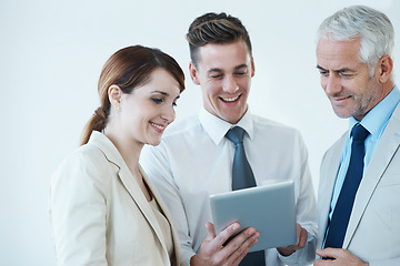 Image showing Business people, tablet and discussion on report for partnership, communication and meeting in office. Coworkers, collaboration and tech for research on internet, planning and teamwork in workplace