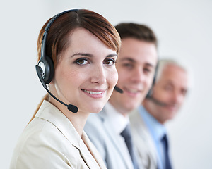 Image showing Woman, call center and face, CRM or contact us with headset and mic, coworking and smile for communication. Telecom, customer service or telemarketing, agent in portrait for tech support or help desk