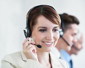 Image showing Woman, callcenter and phone call, CRM or contact us with headset and mic, coworking and smile for communication. Telecom, customer service or telemarketing with agent for tech support or help desk