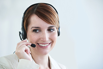 Image showing Woman, callcenter and phone call with headset and mic, CRM or contact us with smile for communication. Telecom, customer service or telemarketing with agent for tech support or help desk at office