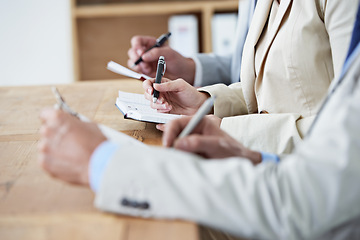 Image showing Hands, writing and learning with business people in boardroom of office or seminar or upskill development. Meeting, training and growth with employee group in audience or crowd for workshop closeup