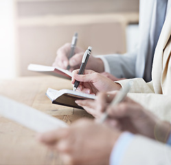 Image showing Hands, writing and meeting with business people in boardroom of office or seminar or upskill development. Learning, training and growth with employee group in audience or crowd for workshop closeup