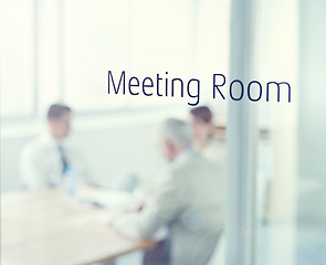 Image showing Business people, glass and meeting room sign for planning, collaboration or teamwork at office. Group, blurry or employees with strategy for discussion, conversation or brainstorming at workplace