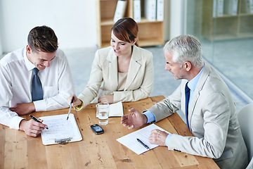 Image showing Business people, boardroom and signature on paperwork in meeting or lawyer agreement, partnership or negotiation. Men, woman and document in corporate office for collaboration, consultant or contract
