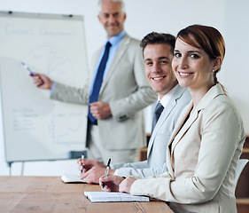 Image showing Portrait or business people or boss teaching in a meeting for presentation, coaching or team training. Smile, man or woman in boardroom meeting for skills, group learning or education in a mentorship