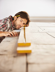 Image showing Artisan, planning and indoors in garage, professional and wood from nature, skill. Person, working and builder for job, career and building for maintenance, carpentry and construction worker