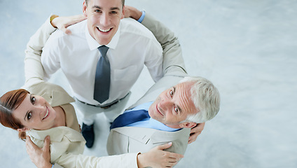 Image showing Business people, portrait and huddle for solidarity or support in workplace, teamwork and together. Coworkers, top view and united in embrace or coworkers in office, collaboration and hug in meeting