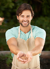 Image showing Man, hands together and seeds in portrait for sustainability, planting and growth in outdoor nursery. Male gardener, face and happy with grains for development, nurture and cultivation for future