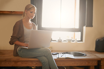Image showing Woman, freelancer and laptop for journalism, remote work and internet connection in kitchen for info. Female person, editor and website for research or online news, blog and typing an article on tech