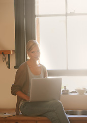 Image showing Woman, freelancer and laptop in portrait, remote work and internet connection in kitchen for info. Female person, editor and website for research or online news, blog and typing an article on tech