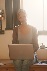 Image showing Woman, freelancer and laptop in portrait, writing and internet connection in kitchen for info. Female person, editor and website for research or online news, blogging and typing an article on tech