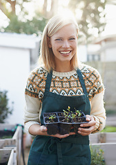 Image showing Gardening, backyard and portrait of happy woman with plants for landscaping, planting flowers and growth. Agriculture, nature and person outdoors for environment, ecology and nursery in herb garden