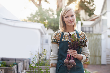 Image showing Happy, woman and vegetable with portrait and beetroot in backyard with sustainability. Green, eco friendly and outdoor with healthy growth and a relax gardener with plant nursery and agriculture