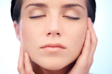 Image showing Skincare, beauty or face of calm woman in studio isolated on blue background to relax for wellness. Smooth, anti aging or natural results of model, lady or confident person with shine, youth or glow