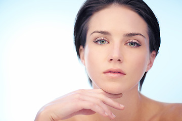 Image showing Skincare, model or portrait of woman in studio isolated on blue background for wellness or anti aging. Smooth, spa or natural dermatology results of lady or confident person with beauty, face or glow